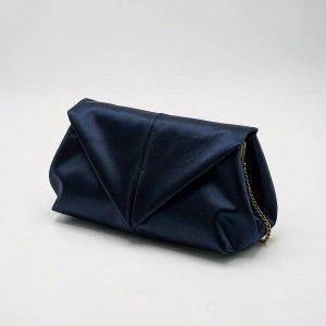 Deep midnight-navy folded satin evening clutch with a detachable brass chain