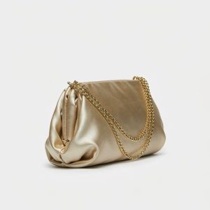 Champagne-gold satin evening clutch with a fine brass chain