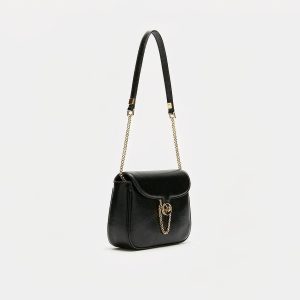 Small black smooth calf leather crossbody bag with a rounded flap and gold push-lock